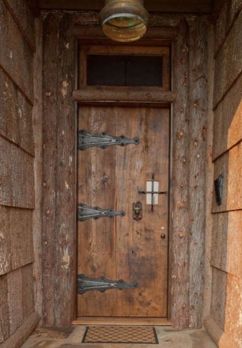 This magnificent door was custom built by Southern Accents from a slab of salvaged wood for customer Ann Pollard. 