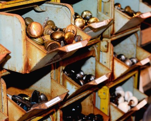 Southern Accents has one of the largest collections of salvaged hardware in the Southeast. These bins are filled with salvaged brass, glass, and porcelain knobs.