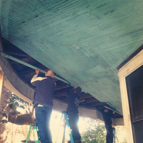 The Southern Accents team salvaging this beautiful blue porch ceiling from an 1890's house in Greenville, Alabama.
