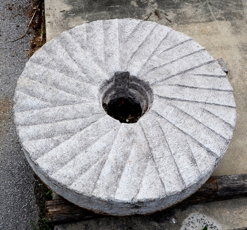 The hand carved grooves on the face of this millstone are beautiful.